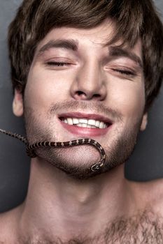 Portrait of a Young Handsome Man with Snake on His Face