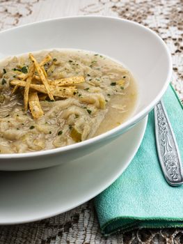 French onion soup with croutons in a white oval modern dish