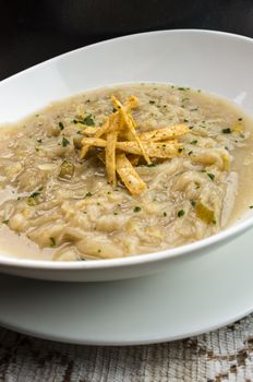French onion soup with croutons in a white oval modern dish