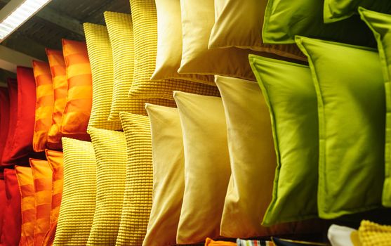 comfortable colorful fabric cushions on modern store shelves.