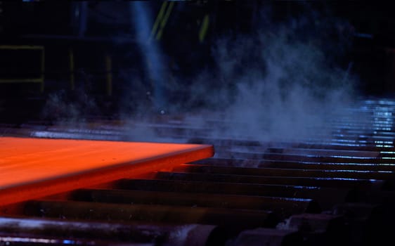 Hot steel plate on conveyor