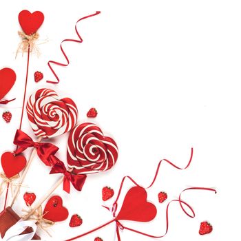 Valentines day decoration and heart shaped lollipops isolated on white background