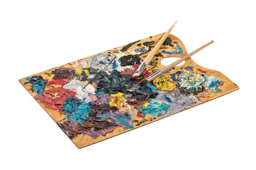 Old wooden palette with paint on an isolated studio background