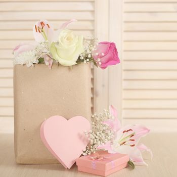 Valentine day heart shapes paper card and bouquet of flowers