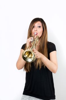 Funny beautiful woman playing trumpet isolated on white background