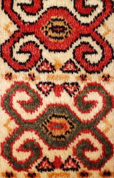 geometric  pattern old Persian carpet closeup