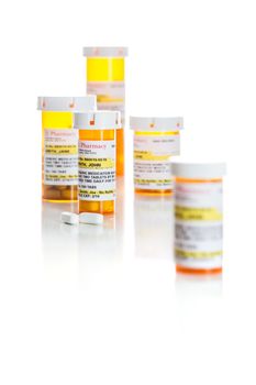 Non-Proprietary Medicine Prescription Bottles and Pills Isolated on a White Background.