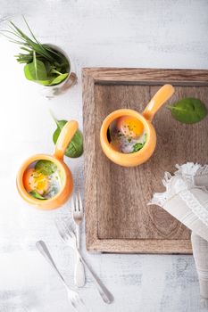 Casserole with eggs, spinach and parmesan for breakfast