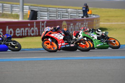 BURIRAM - DECEMBER 4 : Natthakorn Uttaranakorn of Thailand with Honda CBR300R motorcycle of CBR300R Thailand Dream Cup in Asia Road Racing Championship 2016 Round 6 at Chang International Racing Circuit on December 4, 2016, Buriram, Thailand.