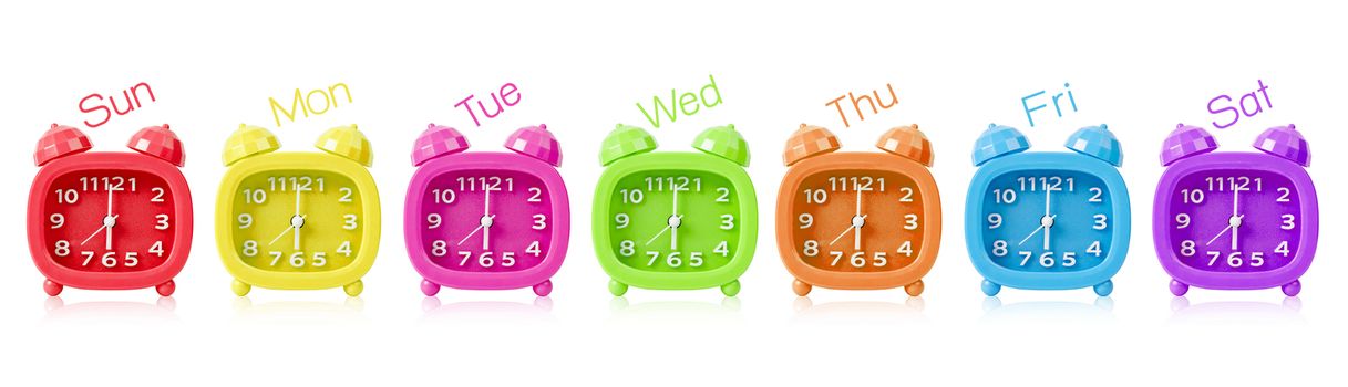 Row of many colorful alarm clock isolated on white background.