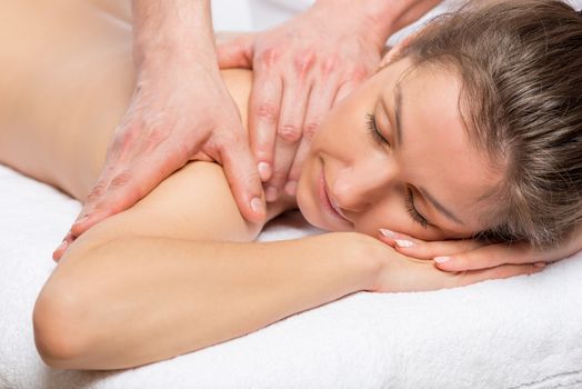 young beautiful girl during the massage relaxed