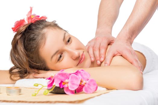 relaxed woman surrounded by flowers, spa treatment