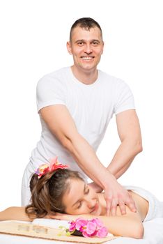 a male massage therapist at the spa cabinet and a young woman