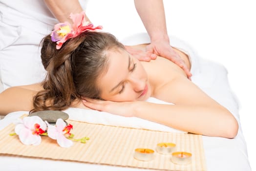 brunette on massage table relaxing during the massage at the spa