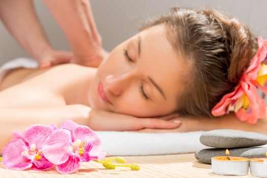 woman's face out of focus, a massage in the spa