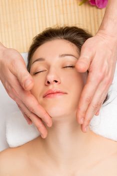woman in salon on massage procedure. face close up