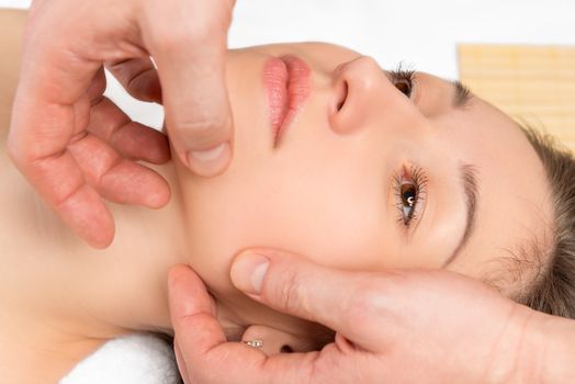 spa facial massage hands cosmetologist man closeup