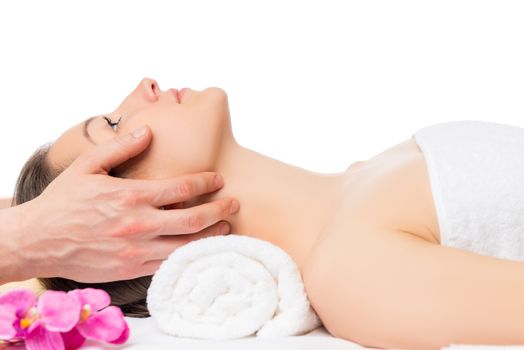 Horizontal portrait of a woman lying on a massage table isolated