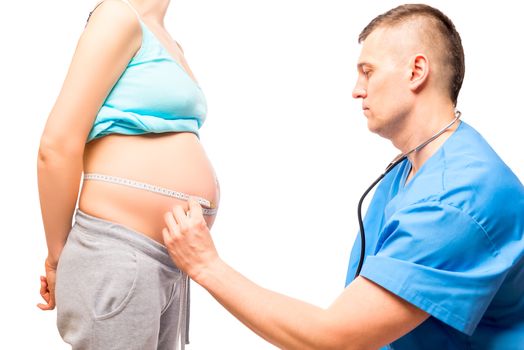 Portrait of doctor and pregnant woman, the measurement during pregnancy isolated