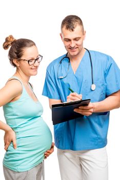 Young expectant mother on reception at the doctor gynecologist