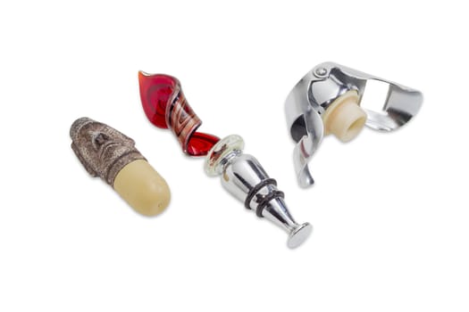 Two various decorative wine stopper and special wine stopper for sparkling wine on a light background
