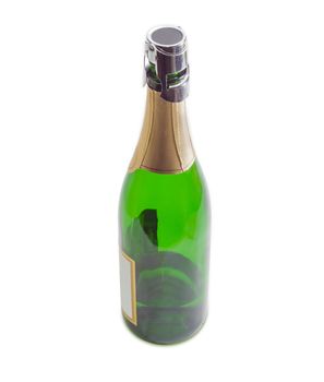 Bottle with sparkling wine, closed with special stopper for wine storage on a light background closeup
