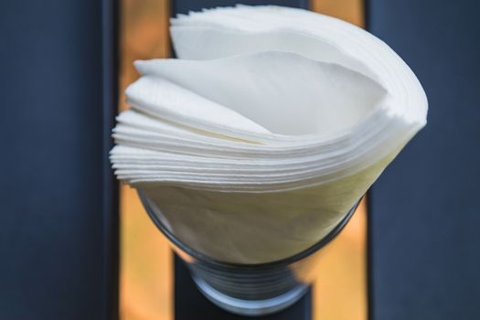 white tissue papers in glass on the table