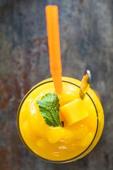 top view of mango smoothie in glass