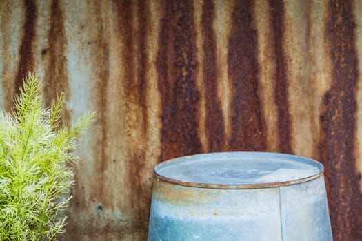 watering can with rustic vintage background