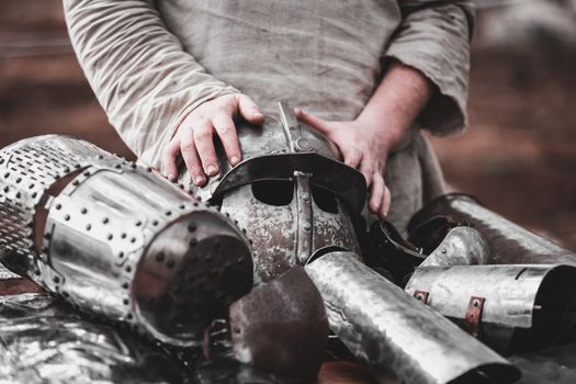 medieval knight armor and man's hand close-up