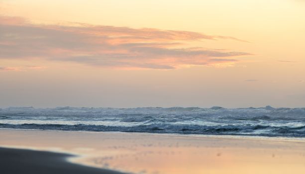 the landscape sea waves on sunset background