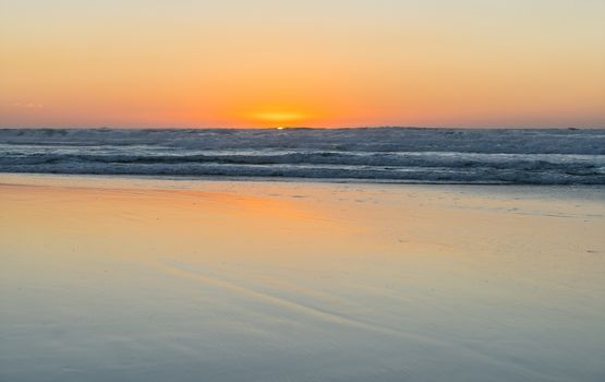 the landscape sea waves on sunset background