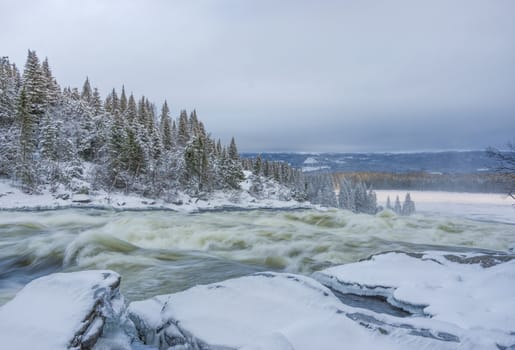 Tannoforsen waterfall in Sweden, does not freeze in the winter the water falls from a height of between stones