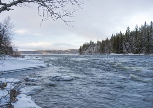 Tannoforsen waterfall in Sweden, does not freeze in the winter the water falls from a height of between stones