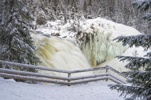 Tannoforsen waterfall in Sweden, does not freeze in the winter the water falls from a height of between stones