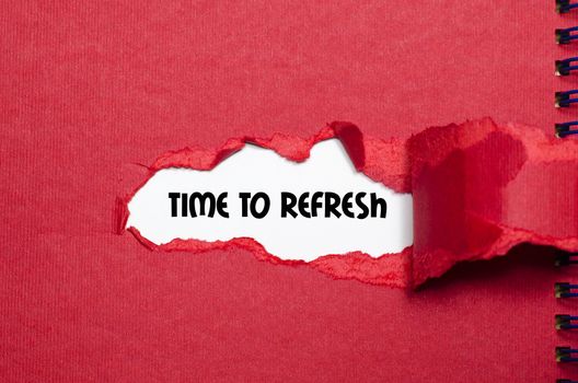 The word time to refresh appearing behind torn paper