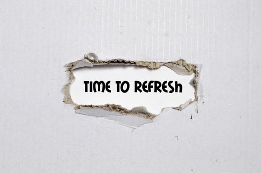 The word time to refresh appearing behind torn paper