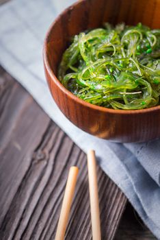 Chuka salad  in the bowl  on the wooden table