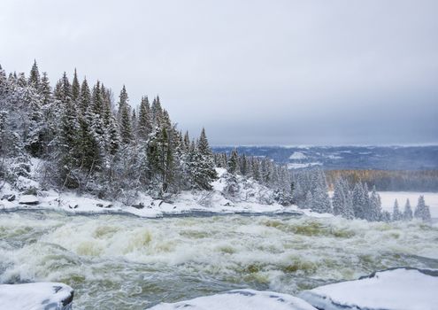 Tannoforsen waterfall in Sweden, does not freeze in the winter the water falls from a height of between stones