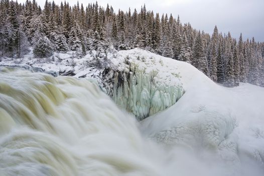 Tannoforsen waterfall in Sweden, does not freeze in the winter the water falls from a height of between stones