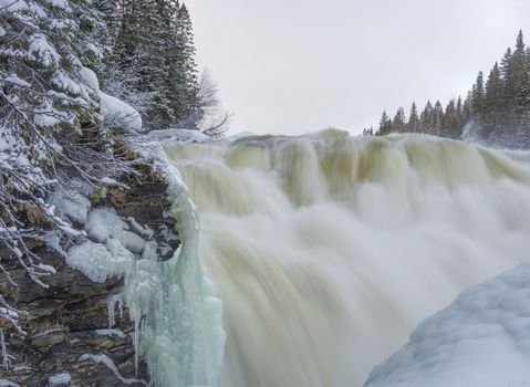 Tannoforsen waterfall in Sweden, does not freeze in the winter the water falls from a height of between stones