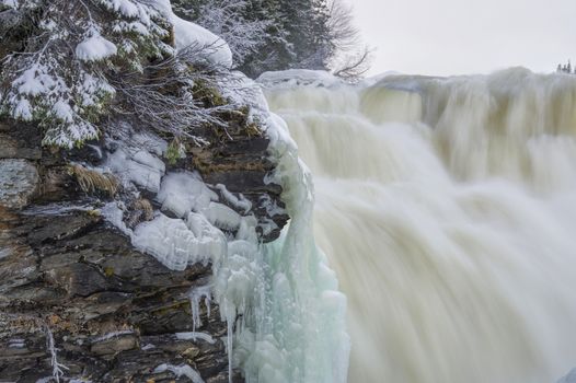 Tannoforsen waterfall in Sweden, does not freeze in the winter the water falls from a height of between stones