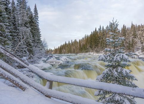 Tannoforsen waterfall in Sweden, does not freeze in the winter the water falls from a height of between stones