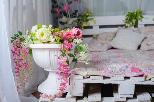 bedroom with the decor of flowers in rustic style.
