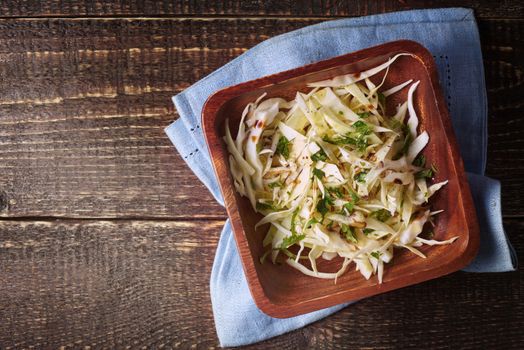 Cabbage salad on the wooden table top view