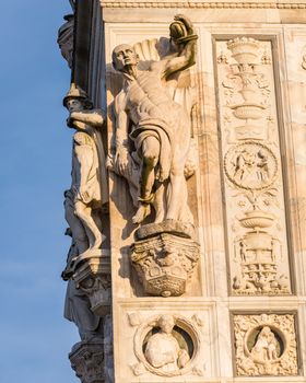 Beautiful marble statues from the Renaissance period of the Pavia Carthusian monastery at sunset,Italy.