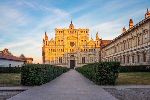 View of the cathedral of Certosa di Pavia Carthusian monastery at sunset.