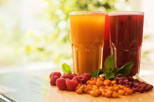 set of fruit non-alcoholic drink with cranberries raspberries and sea buckthorn