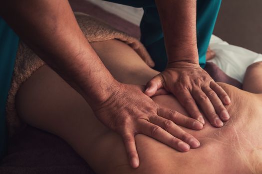 Woman having a massage at spa