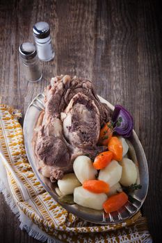 Pot-Au-Feu - French beef stew on a wooden surface